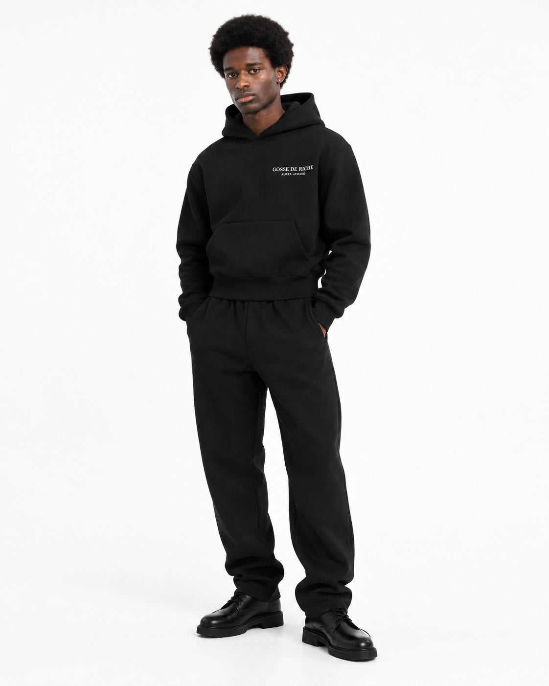 Edwin wearing the GDR Hoodie on a white studio background